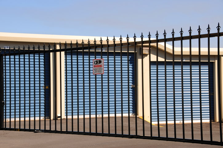 Secure storage units within a fenced storage facility.