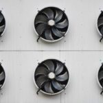 Air vents with fans on the side of a climate-controlled storage unit
